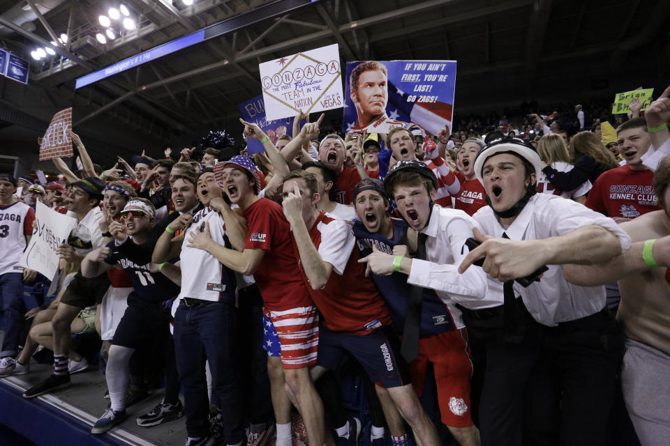 Members of the Gonzaga student section have been dressing up like Mormon missionaries at BYU games, and the school wants them to stop. (AP Photo)