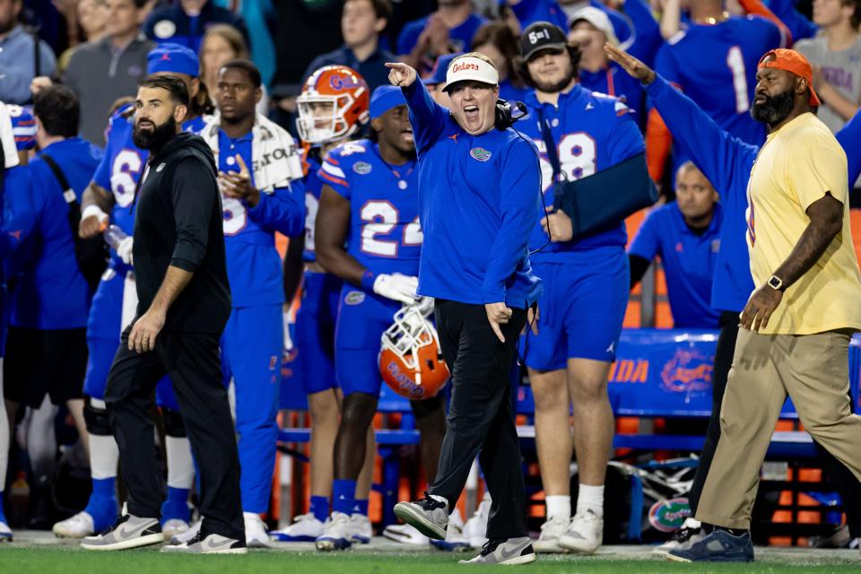 Florida Gators defensive coordinator Austin Armstrong smiles and gestures after a defensive stop during the second half against the Florida State Seminoles at Steve Spurrier Field at Ben Hill Griffin Stadium in Gainesville, FL on Saturday, November 25, 2023. [Matt Pendleton/Gainesville Sun]