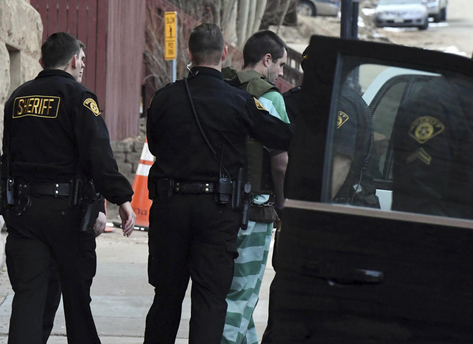 Patrick Frazee is escorted to an awaiting SUV after a hearing at the Teller County Courthouse in Cripple Creek, Colo., on Tuesday, Feb. 19, 2019. Following the daylong hearing, Teller County Judge Scott Sells found there is enough evidence for Frazee to stand trial for murder and other charges. He was arrested in Dec. 2018, about a month after Kelsey Berreth, 29, was last seen alive on Thanksgiving Day. Frazee and the victim, Berreth, have an infant daughter together. (Jerilee Bennett/The Gazette via AP)