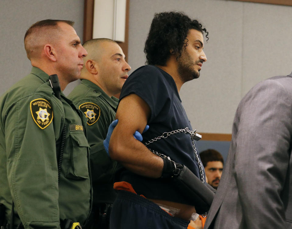 Mohamed Abdalla Mahmoud, right, appears in court Tuesday, Aug. 21, 2018, in Las Vegas. Mahmoud was wounded by police after allegedly opening fire with a handgun in a Las Vegas clothing store. (AP Photo/John Locher)