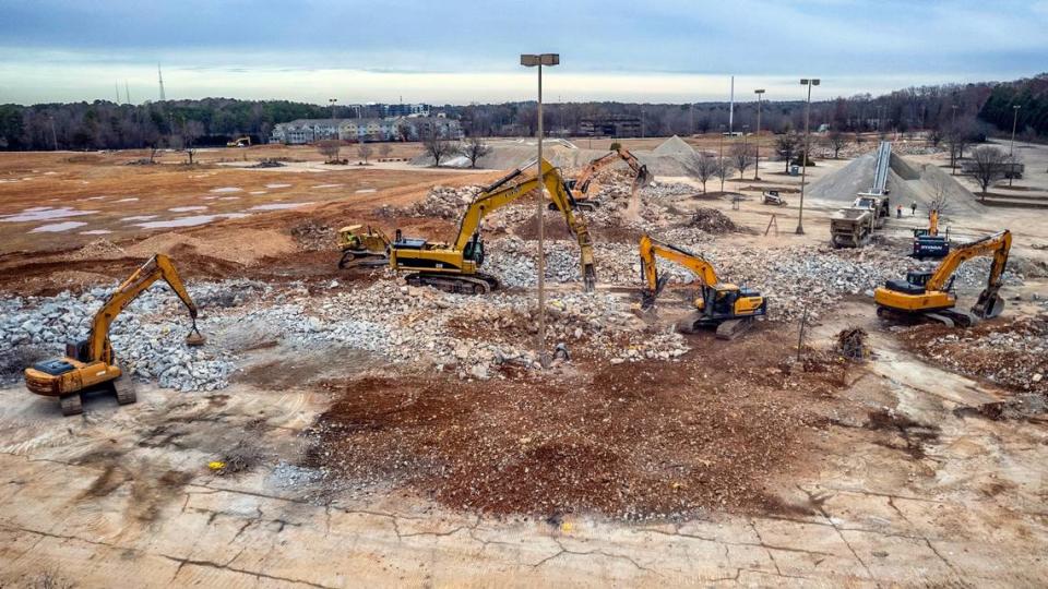 A demolition crew demolishes the last remnants of Cary Towne Center Tuesday, Dec. 20, 2022. The site will be the future home of Epic Games.