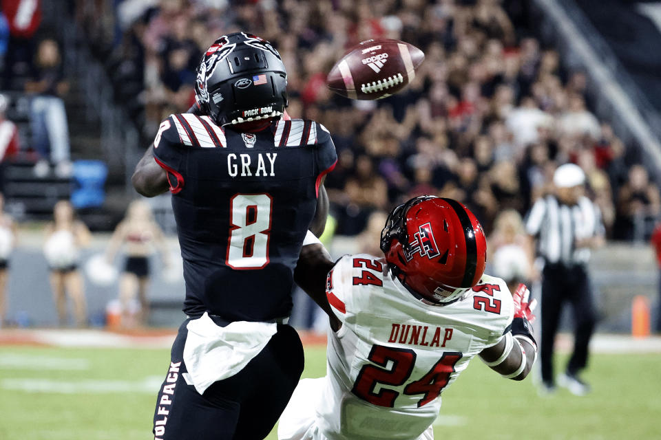 Texas Tech's Malik Dunlap (24) breaks up a pass intended for North Carolina State's Julian Gray (8) during the first half of an NCAA college football game in Raleigh, N.C., Saturday, Sept. 17, 2022. (AP Photo/Karl B DeBlaker)