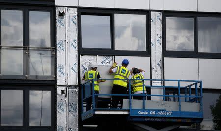 Cladding is removed from the side of Whitebean Court in Salford, Manchester, Britain June 26, 2017. REUTERS/Andrew Yates