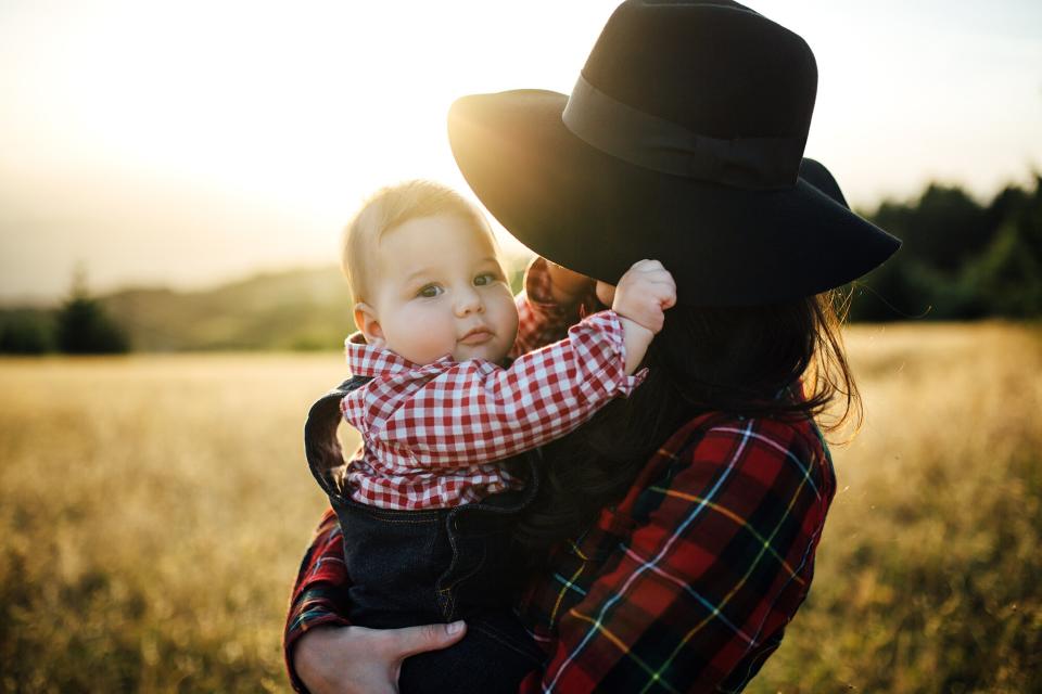 Mother and playful son at the mountain field