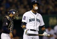 U.S. Major League Baseball (MLB) All-Stars' Robinson Cano of the Seattle Mariners reacts as he steps out of the batter's box against Japan during the eighth inning of an exhibition baseball game in Tokyo November 14, 2014. REUTERS/Toru Hanai (JAPAN - Tags: SPORT BASEBALL)