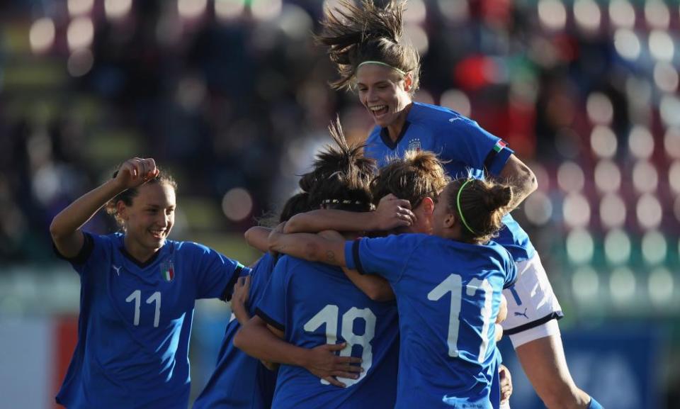 Barbara Bonansea (top) celebrates with her teammates after scoring the team’s third goal during the Fifa Women’s World Cup qualifier match between Italy and Romania in October