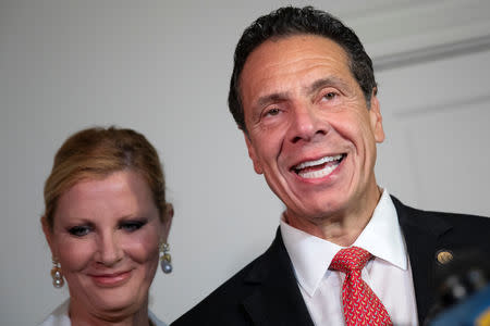 New York Governor Andrew Cuomo stands with his girlfriend Sandra Lee as he speaks to the media after voting in the New York Democratic primary election at the Presbyterian Church in Mt. Cisco, New York, U.S., September 13, 2018. REUTERS/Mike Segar