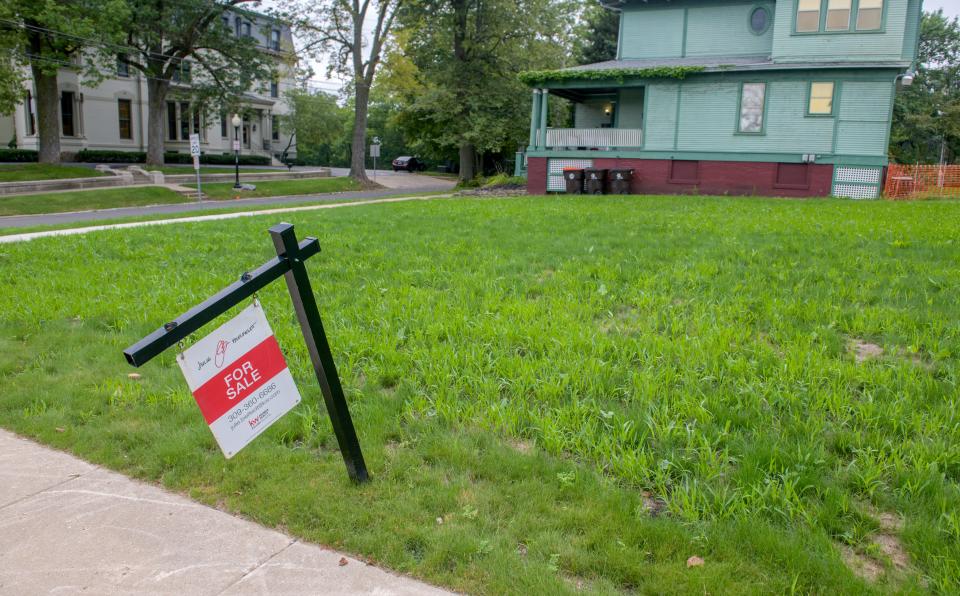 A "For Sale" sign stands on the property once occupied by the Hale Memorial Church at corner of Main and High streets in Peoria.