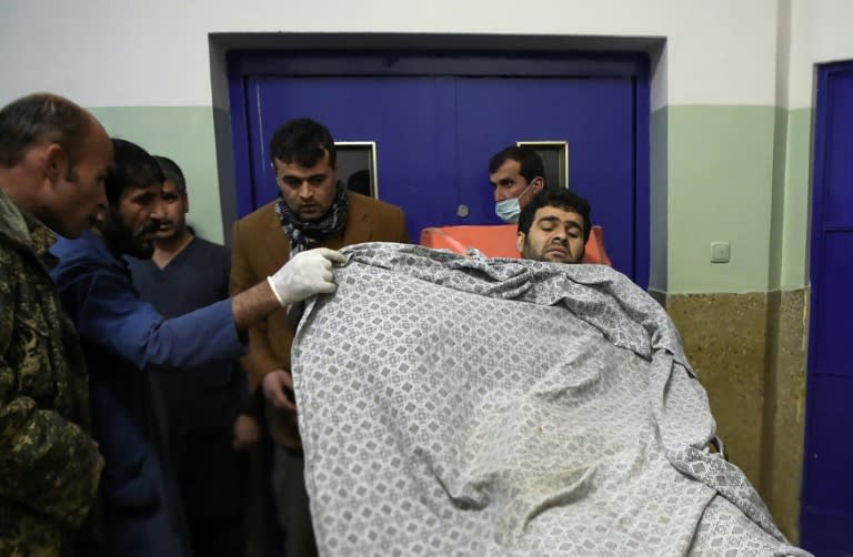 An injured Afghan man arrives for treatment at Wazir Akbar Khan hospital following a suicide blast suicide blast near the Afghan Supreme Court in Kabul on February 7, 2017