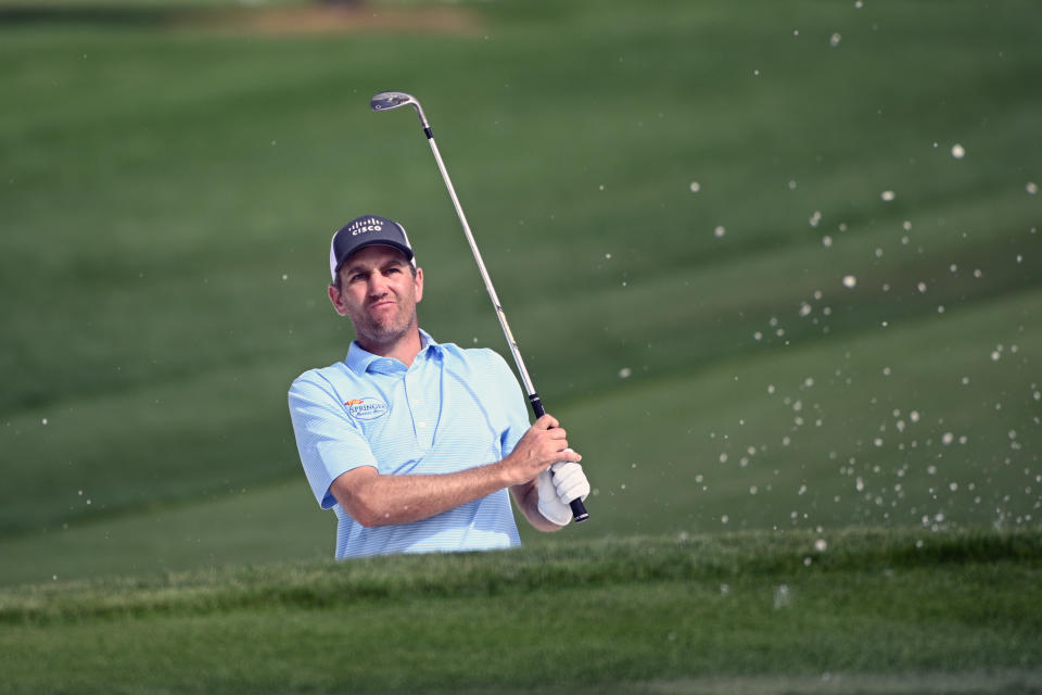 FILE - In this March 5, 2020, file photo, Brendon Todd watches his shot after hitting from a bunker onto the ninth green during the first round of the Arnold Palmer Invitational golf tournament in Orlando, Fla. Todd says he is willing to take risks from the new coronavirus when the PGA Tour resumes its season. (AP Photo/Phelan M. Ebenhack, File)