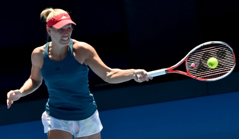 Angelique Kerber of Germany hits a return during a practice session ahead of the Australian Open tennis tournament in Melbourne on January 15, 2017