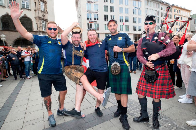 Keith MacMillan in lederhosen with Paul Marshall, Stuart King, Canadian friend Ben pettenick and a bagpiper