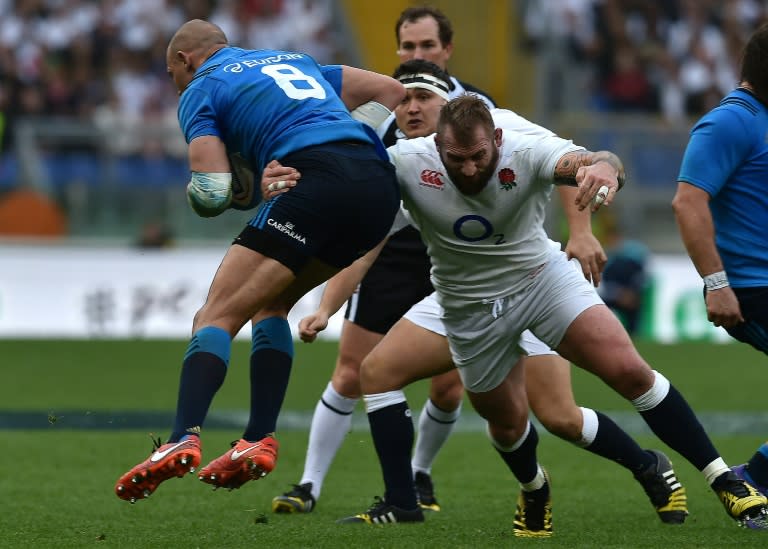 Italy's Sergio Parisse (L) is takled by England wing Jack Nowell during their Six Nations clash at Rome's Olympic stadium on February 14, 2016