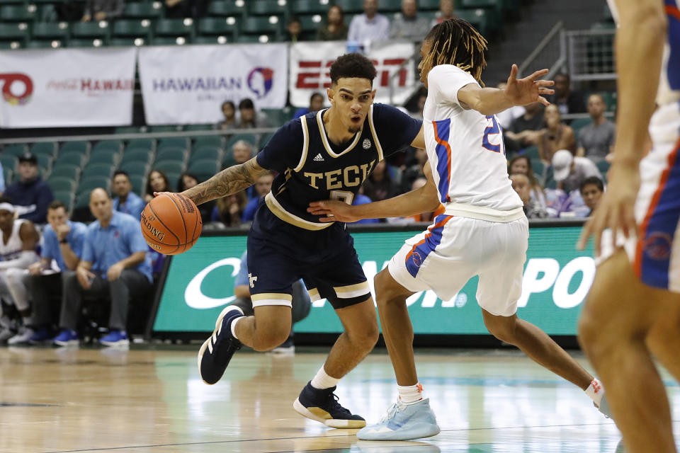 Georgia Tech guard Jose Alvarado (10) tries to get past Boise State guard Derrick Alston (21) during the second half of an NCAA college basketball game Sunday, Dec. 22, 2019, in Honolulu. (AP Photo/Marco Garcia)