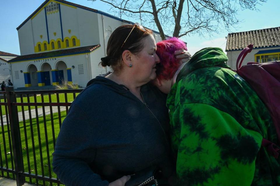 Allison White, 17, right, hugs her mother Sascha Vogt, left, after being released from lockdown after a student was shot in the arm at Grant High School on Tuesday, Jan. 30, 2024. “It was really stressful, I still keep feeling like I’m going to throw up but I’m not. I just wish like we don’t act like it’s normal like every time something like this happens they just expect us to come back to school the next day like nothing happened, but It’s not, it’s not normal and we have to stop treating it like it is,” said White.