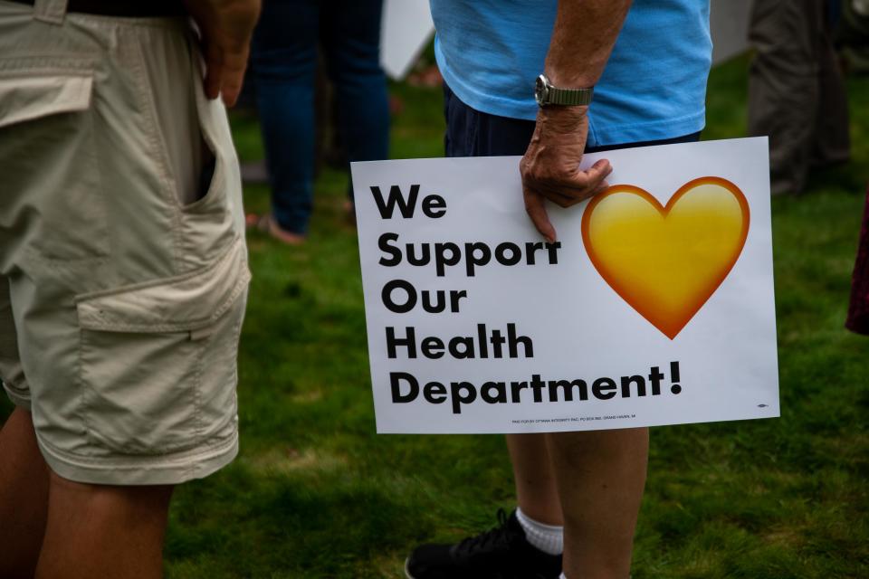 Hundreds gather to show their support for the Ottawa County Health Department as they face steep budget cuts from the county's board of commissioners Wednesday, Sept. 6, 2023, in Holland Township.