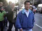 FILE - In this March 26, 2014 file photo, California state Sen. Leland Yee, D-San Francisco, right, leaves the San Francisco Federal Building in San Francisco. The FBI spent many millions of dollars and used more than a dozen undercover operatives posing as honest businessmen and Mafia figures alike during its seven year organized crime investigation centered in San Francisco’s Chinatown. Now, an increasing number of the defendants caught up in the probe that has ensnared a state senator and an aide are arguing that the FBI and its undercover agents are guilty of entrapment, luring otherwise honest people to go along with criminal schemes hatched by federal officials. (AP Photo/Ben Margot, File)