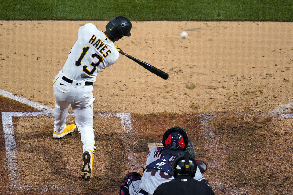 Pittsburgh Pirates' Ke'Bryan Hayes (13) hits a three-run double off Cleveland Indians relief pitcher Kyle Nelson during the sixth inning of a baseball game in Pittsburgh, Friday, June 18, 2021. (AP Photo/Gene J. Puskar)