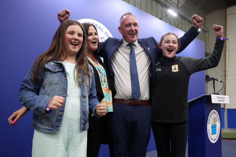 Cathal Mallaghan celebrates after being elected and is pictured with his wife Louise and two daughters Aoife and Saorla