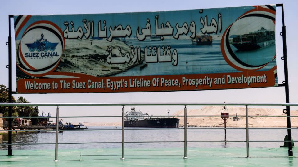 A welcoming sign is placed on the shore of the Suez Canal in the northeastern Egyptian city of Ismailiya, on May 27, 2021. - Ahmad Hassan/AFP/Getty Images