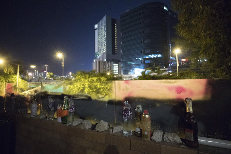 In this Friday, Nov. 22, 2019, photo, molotov cocktails and stones are left after a battle between students and police at the Hong Kong Polytechnic University campus in Hong Kong. Most of the protesters who took over the university have left following clashes with police, but an unknown number have remained inside, hoping somehow to avoid arrest. (AP Photo/Vincent Thian)