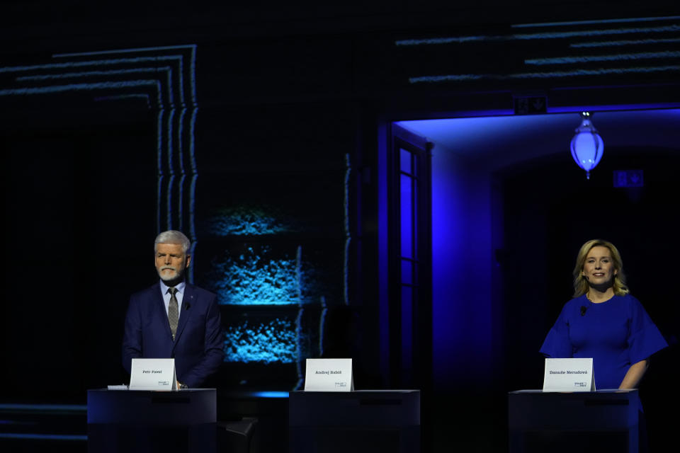 File - Presidential candidates Danuse Nerudova, right, and Petr Pavel wait for the start of a political debate at the National Museum in Prague, Czech Republic, Sunday, Jan. 8, 2023. Populist billionaire Andrej Babis is leading a field of eight candidates hoping to replace Milos Zeman as the first round of the presidential election is set for Jan. 13-14th, 2023. Retired army Gen. Petr Pavel, former chairman of NATO's military committee and former university rector Danuse Nerudova are the main challengers for Babis. (AP Photo/Petr David Josek, File)