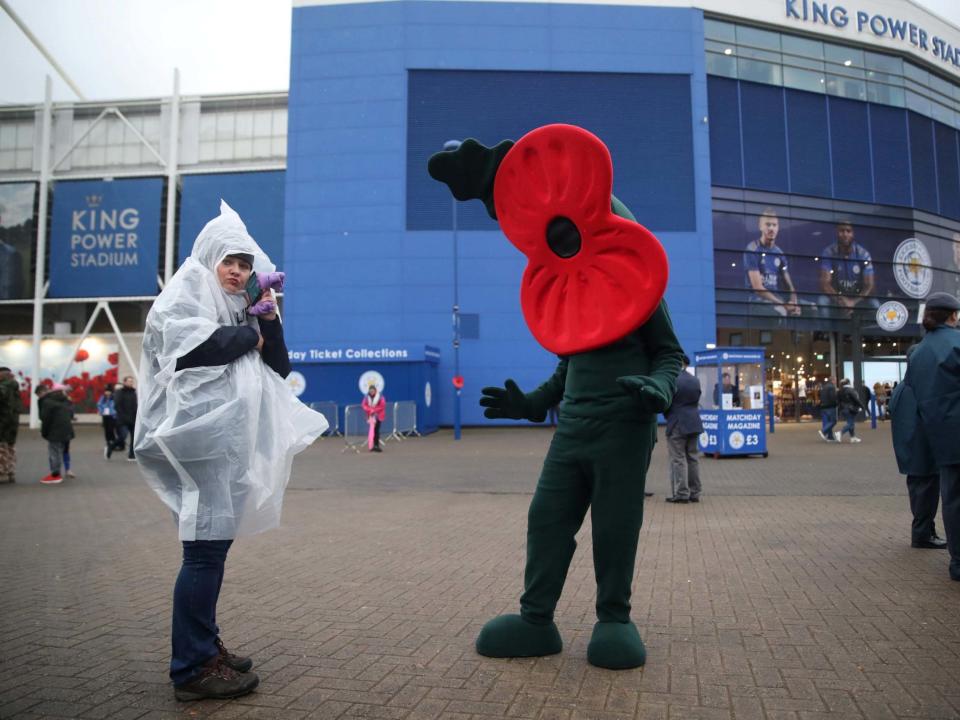 A poppy mascot outside the stadium as part of remembrance commemorations before the match: Action Images via Reuters