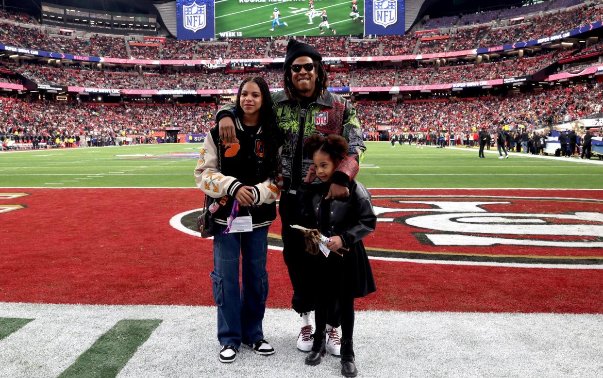 Blue Ivy Carter with her father, Jay-Z, and sister Rumi at the Super Bowl in Las Vegas in February