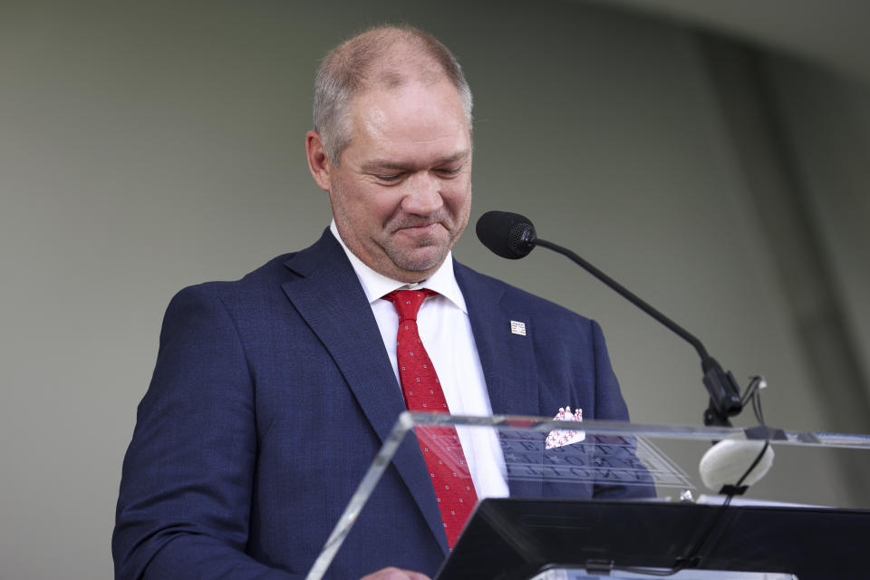 Hall of Fame inductee Scott Rolen reacts during the National Baseball Hall of Fame induction ceremony, Sunday, July 23, 2023, at the Clark Sports Center in Cooperstown, N.Y. (AP Photo/Bryan Bennett)