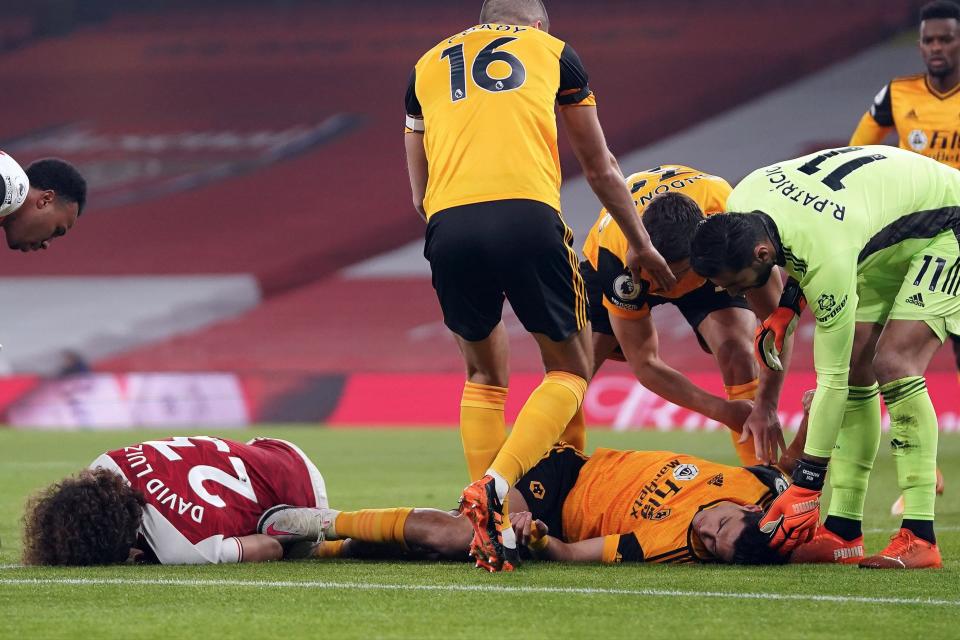 <p>David Luiz and Raul Jimenez collided in sickening fashion on Sunday, with the Wolves striker suffering a fractured skull</p> (POOL/AFP via Getty Images)