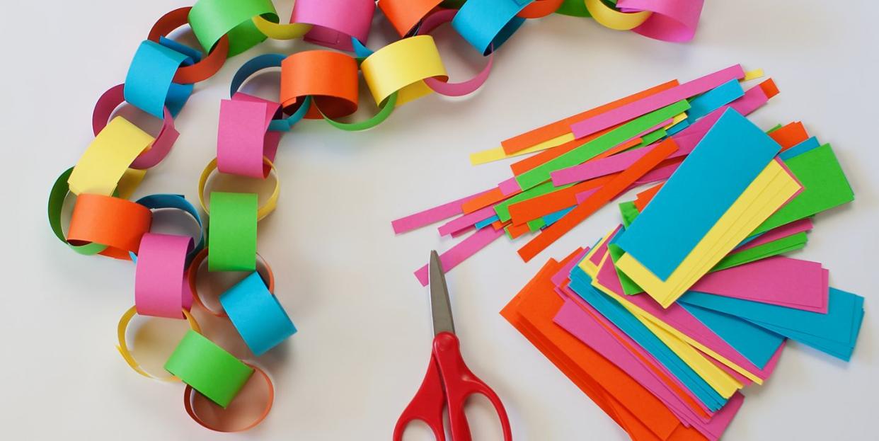 coloured paper and scissors to make paper chains