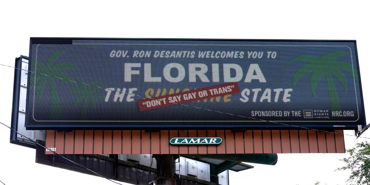 A billboard that says "Florida: The 'Don't Say Gay or Trans' State."