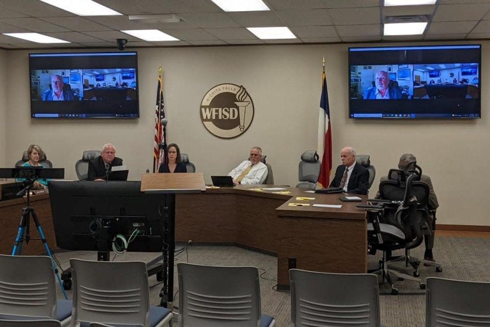 Some members of the Wichita Falls ISD School Board and Acting Superintendent Debbie Dipprey wait for a public hearing to begin Tuesday, May 16, 2022.