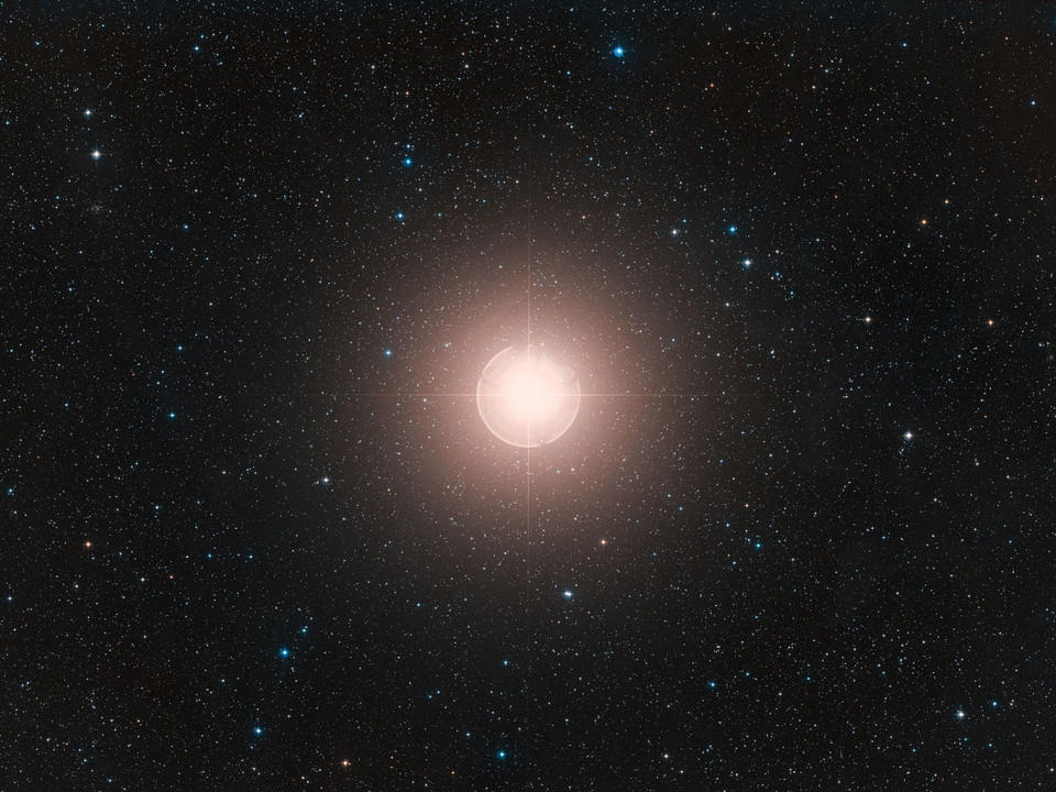 A direct sky image of Betelgeuse. The star is shedding mass as it approaches exploding into a supernova. <cite>ESO/Digitized Sky Survey 2. Acknowledgement: Davide de Martin</cite>