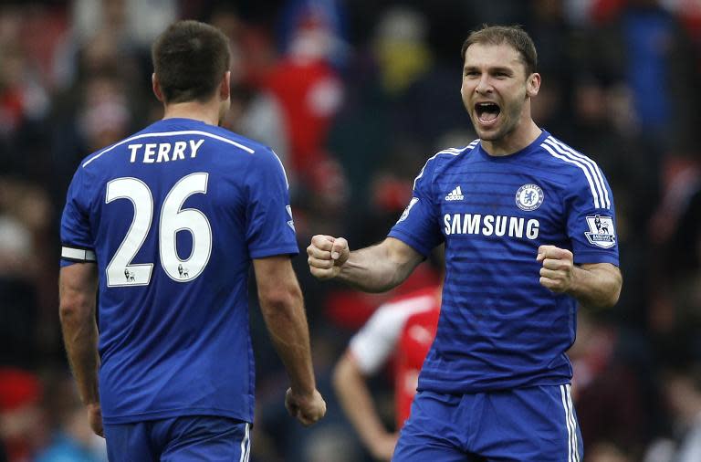 Chelsea's defenders John Terry (L) and Branislav Ivanovic react after the English Premier League football match between Arsenal and Chelsea at the Emirates Stadium in London on April 26, 2015