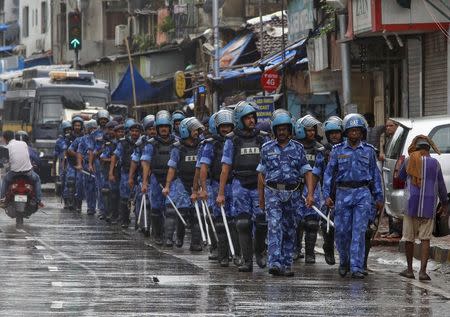 India's Rapid Action Force (RAF) personnel patrol a road near to the residence of Yakub Memon, in Mumbai, India, July 30, 2015. REUTERS/Shailesh Andrade