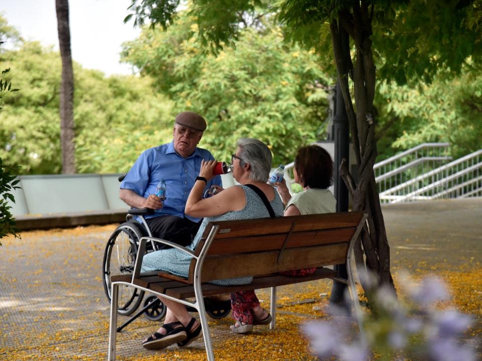 People shelter from the heat as Seville was hit by extreme temperatures (AFP via Getty Images)