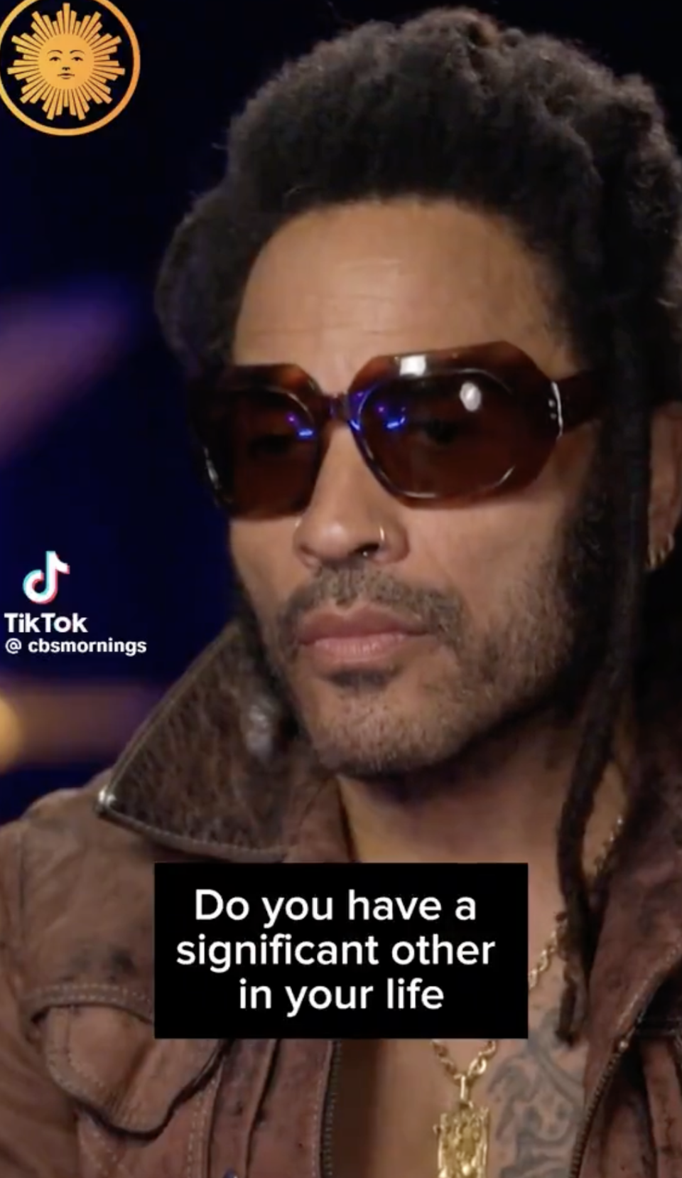 Lenny Kravitz in an interview with "CBS Mornings," wearing sunglasses and a jacket. Text on the image: "Do you have a significant other in your life?"