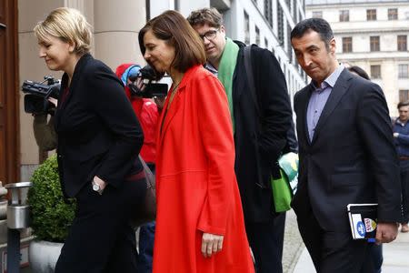 Leaders of the German Green Party Katrin Goering-Eckardt (C) and Cem Ozdemir (R) arrive for exploratory talks at the German Parliamentary Society about forming a new coalition government in Berlin, Germany, November 16, 2017. REUTERS/Axel Schmidt