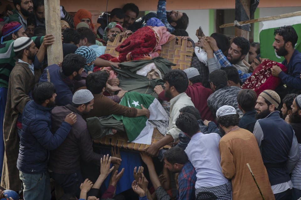 Kashmiri villagers display the body of top rebel commander Gulzar Ahmed Paddroo during his funeral procession in Aridgeen, about 75 kilometers south of Srinagar, Indian controlled Kashmir, Saturday, Sept 15, 2018. Indian troops laid a siege around a southern village in Qazigund area overnight on a tip that militants were hiding there, police said. A fierce gunbattle erupted early Saturday, and hours later, five local Kashmiri rebels were killed. (AP Photo/Dar Yasin)