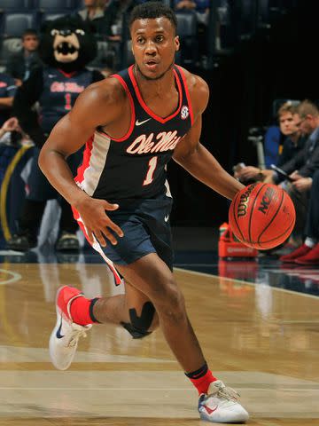 <p>Frederick Breedon/Getty</p> Deandre Burnett plays in the SEC Quarterfinals at Bridgestone Arena on March 10, 2017 in Nashville, Tennessee.