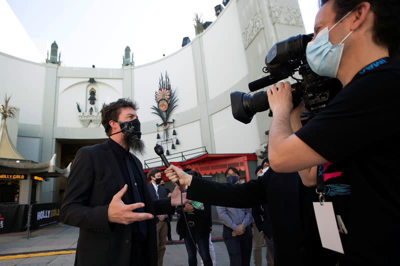 Adam Wingard, director of the upcoming movie "Godzilla vs. Kong", is interviewed at a ribbon cutting ceremony ahead of the reopening of the TCL Chinese theatre during the outbreak of the coronavirus disease (COVID-19), in Los Angeles