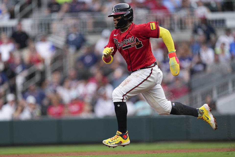 Atlanta Braves' Ronald Acuna Jr. steals second base during the first inning of the team's baseball game against the Chicago White Sox on Friday, July 14, 2023, in Atlanta. (AP Photo/John Bazemore)