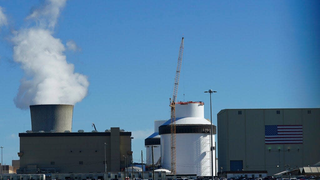 FILE - Reactor number 3 and it's cooling tower stands at Georgia Power Co.'s Plant Vogtle nuclear power plant on Jan. 20, 2023, in Waynesboro, Ga. The nuclear plant has begun splitting atoms in one of its two new reactors, Georgia Power Co. said Monday, March 6, 2023, a key step toward reaching commercial operation at the first new nuclear reactors built from scratch in decades in the United States. (AP Photo/John Bazemore, File)
