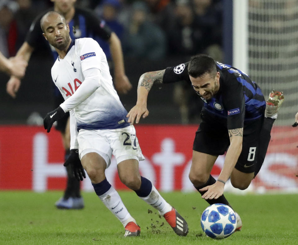 Tottenham midfielder Lucas Lucas, left, and Inter midfielder Matias Vecino in action during a Champions League group B soccer match between Tottenham Hotspur and Inter Milan at Wembley stadium in London, Wednesday, Nov. 28, 2018. (AP Photo/Matt Dunham)