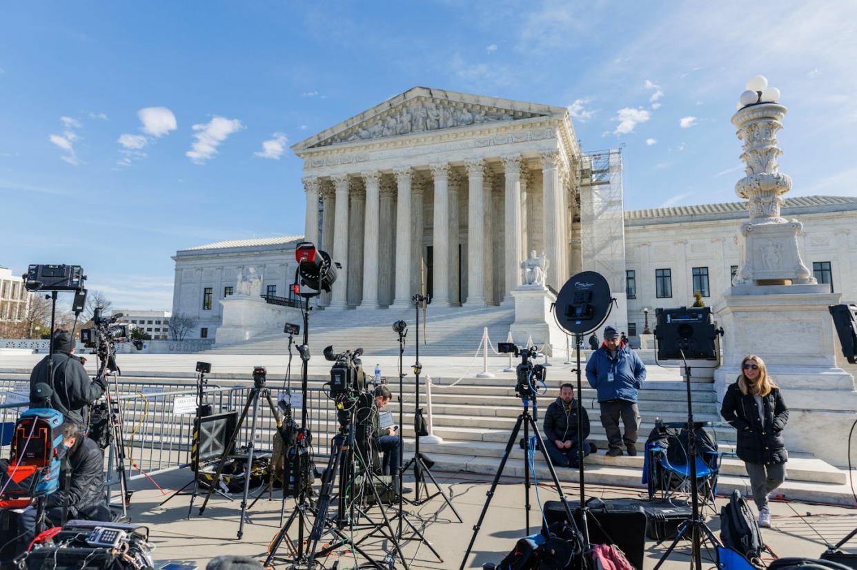 Journalists set up in front of the U.S. Supreme Court building on Feb. 8, 2024. <a href="https://www.gettyimages.com/detail/news-photo/members-of-the-press-stake-out-outside-the-supreme-court-in-news-photo/1991622087" rel="nofollow noopener" target="_blank" data-ylk="slk:Aaron Schwartz/Xinhua via Getty Images;elm:context_link;itc:0;sec:content-canvas" class="link ">Aaron Schwartz/Xinhua via Getty Images</a>