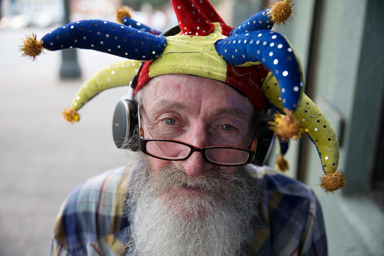 "Crazy Carl" Hickerson outside Esther's Follies on East Sixth Street in 2016. His flower-twirling antics became an integral part of the Esther's Follies sketch comedy show for more than 30 years.