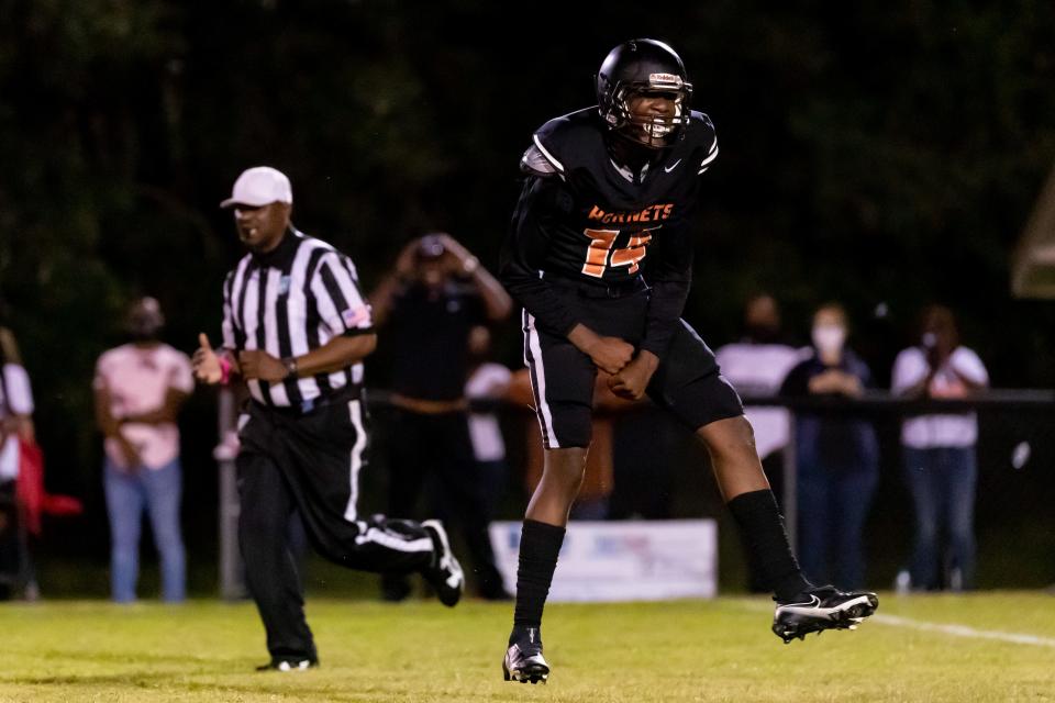 Hawthorne Hornets defender Jailen Ruth (14) celebrates a sack during the Hawthorne Hornets vs. P.K. Yonge Blue Wave football game at the Hawthorne High School Football Stadium in Hawthorne, FL on Friday, October 2, 2020. [Matt Pendleton/Special to the Sun]