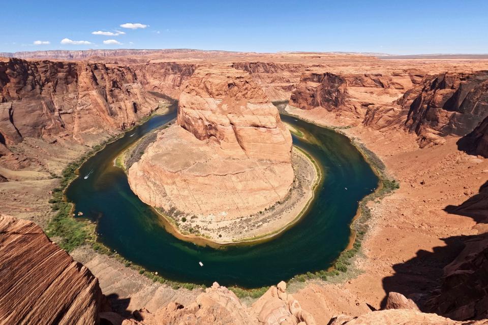 The Colorado River flows at Horseshoe Bend in the Glen Canyon National Recreation Area, Wednesday, June 8, 2022, in Page, Arizona.
