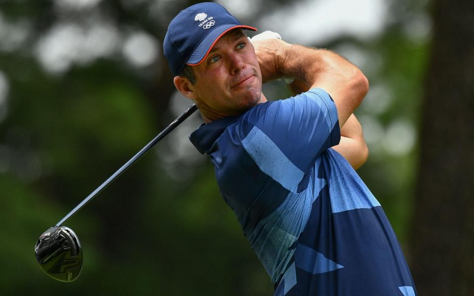 Britain's Paul Casey watches his drive from the 5th tee in round 2 of the mens golf individual stroke play during the Tokyo - AFP